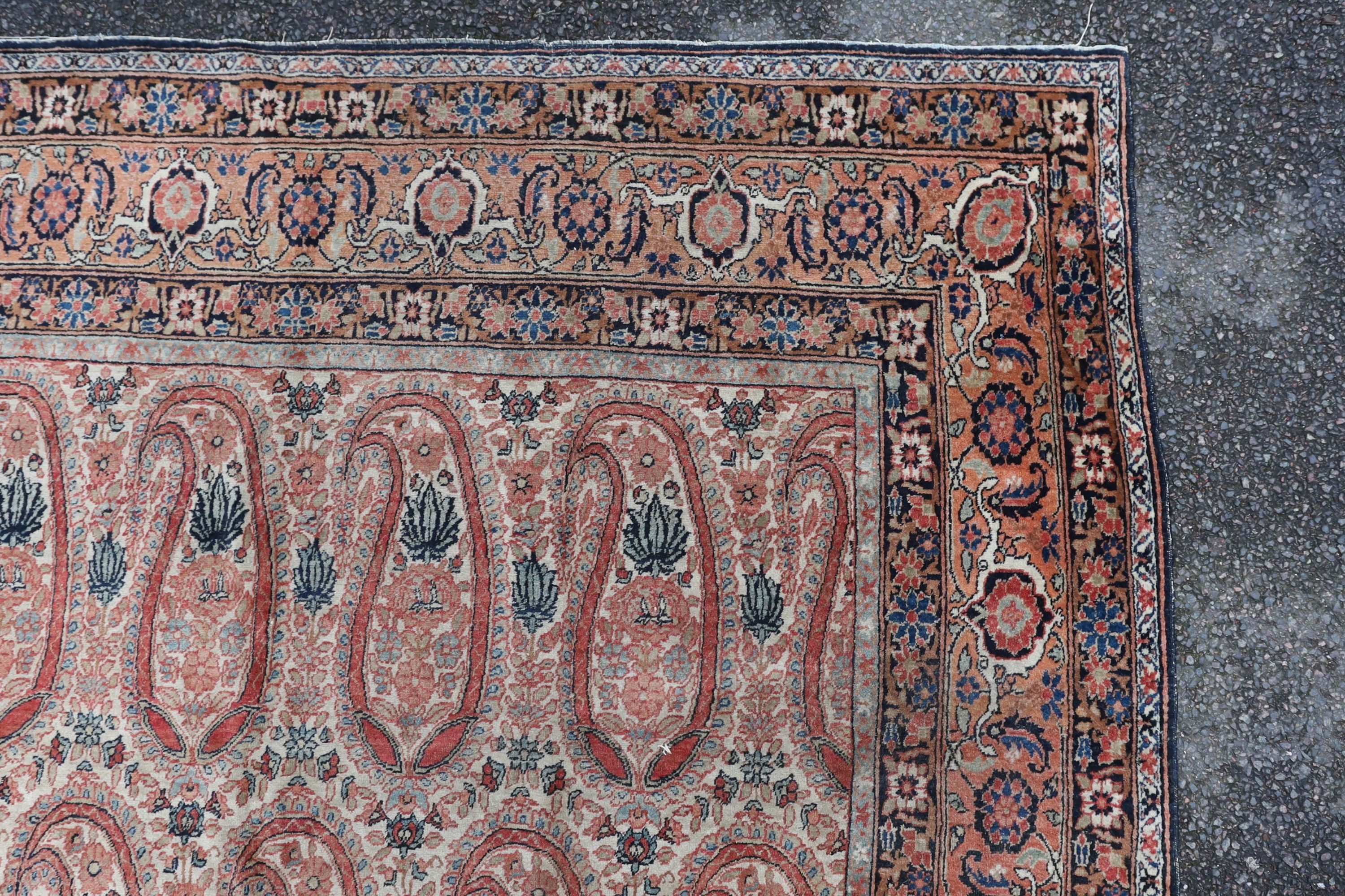A Kerman rug ivory ground carpet, 360 x 218cm.